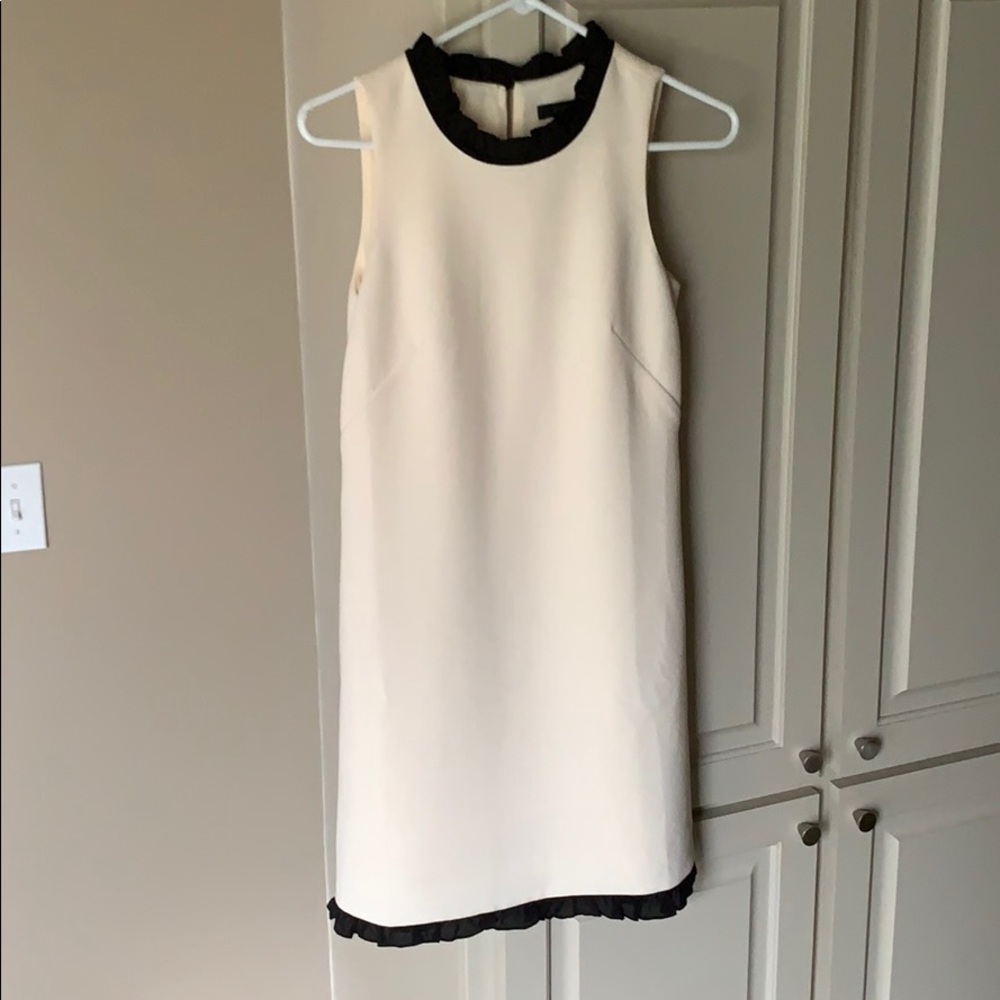 Cream dress with black lace trim